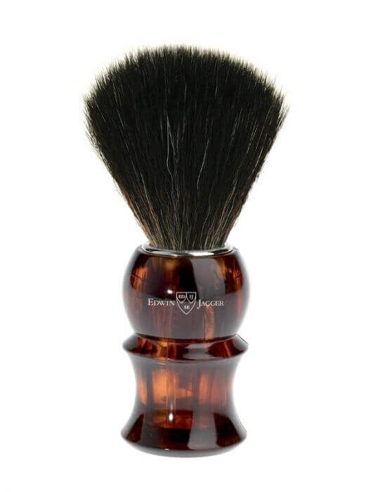 Aukštos kokybės sintetinis skutimosi šepetėlis Edwin Jagger Tortoiseshell Black Synthetic.   Sintetinis pluoštas yra etiška, draugiška veganams, prieinama alternatyva barsukų plaukams.